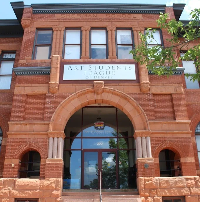 Entrance of the Art Students League of Denver in a historic brick building.