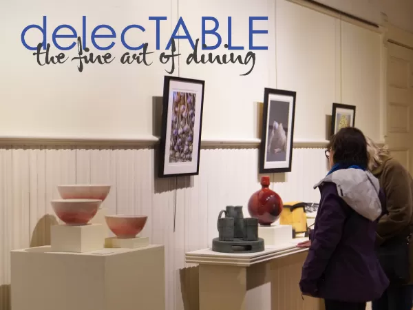 attendees viewing ceramic works at delecTABLE exhibit
