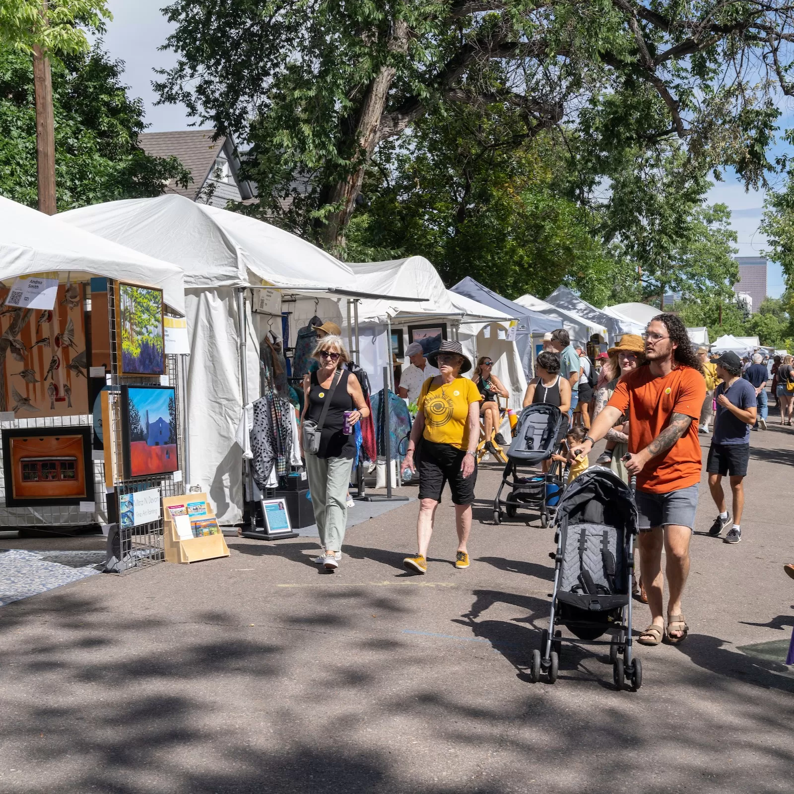 Summer Art Market Visitors walking by artists booths